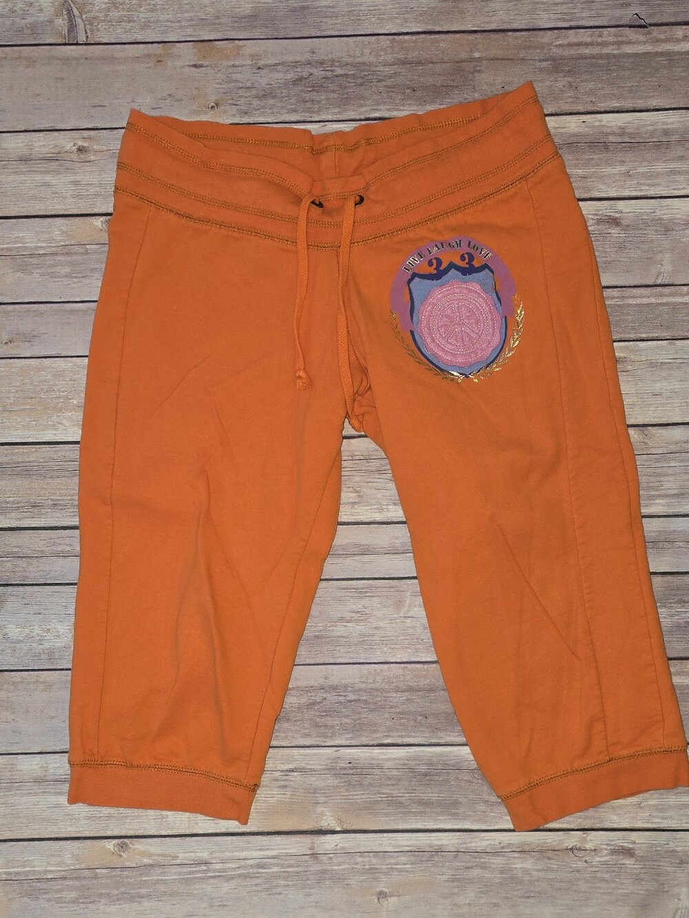 Orange Drawstring Capri Sweatpants with Embroidered Patch